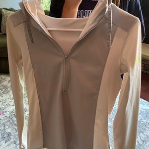 White and grey women’s Nike half zip. W/ neon logo